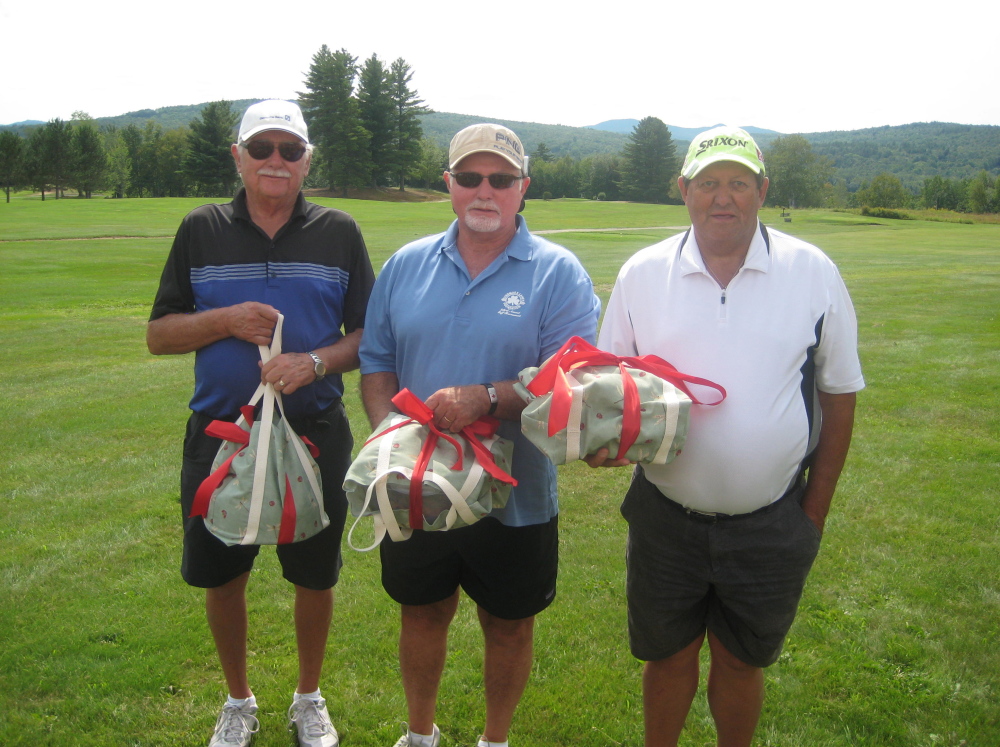 Lowest gross winners, from left, are Cliff Harris, Dick Austin and Bruce Dyke. Rusty Clukey missing from picture.