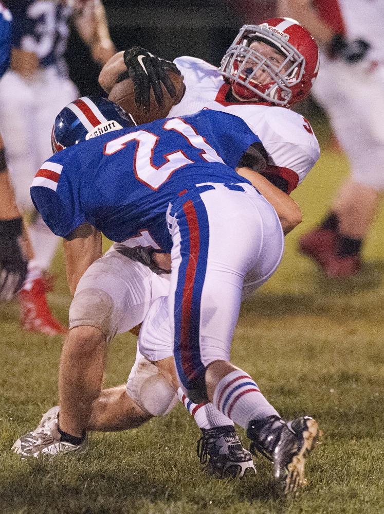 Kevin Bennett photo 
 Messalonskee's Leigh Mills brings down Cony running back Joel Bennett during the second quarter of a Pine Tree Conference Class B game Friday night at Veterans Field in Oakland.