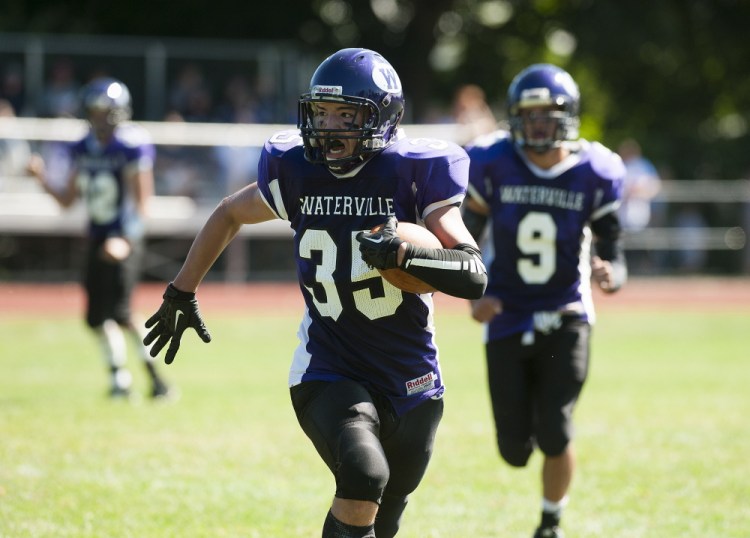 Kevin Bennett photo 
 Waterville's Devon Begin sprints toward the end zone during the first quarter of a game against Hermon on Saturday in Waterville.