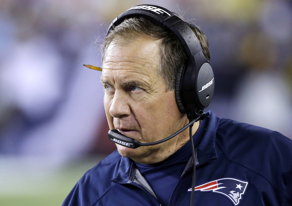 In this photo taken last Thursday, New England Patriots head coach Bill Belichick watches from the sideline in the second half of a game against the Pittsburgh Steelers in Foxborough, Mass. The coach lashed out on Friday against accusations that the Patriots tampered with the Pittsburgh coaching communications during the game.