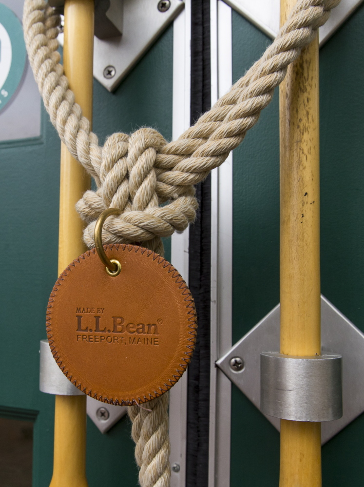 Rope secures handles on a flagship store door, which has no locks, during the temporary closing Sunday.