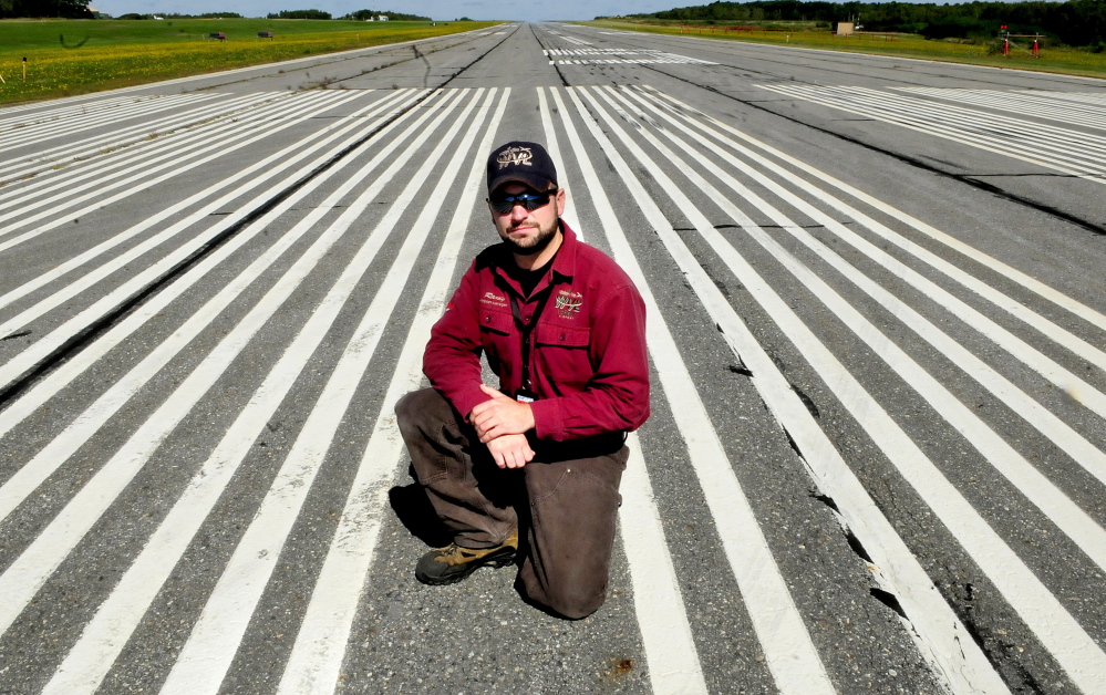 Robert Lafleur Airport Manager Randy Marshall on the primary runway at the Waterville airport last September. The City Council Tuesday will be updated on an upgrade to the airport’s longest runway.