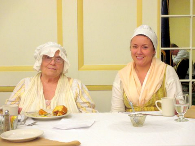 AUGUSTA — Judy Temple, left, and Melissa Tobin, clad in costumes of Colonial Days, recently presented a program to the Augusta Kiwanis Club about how things went in the early days of The Fort, the oldest surviving wooden fort in North America.