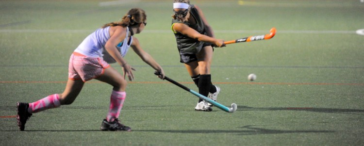 The Winslow High School field hockey team practices on the artificial turf at Thomas College last October.
