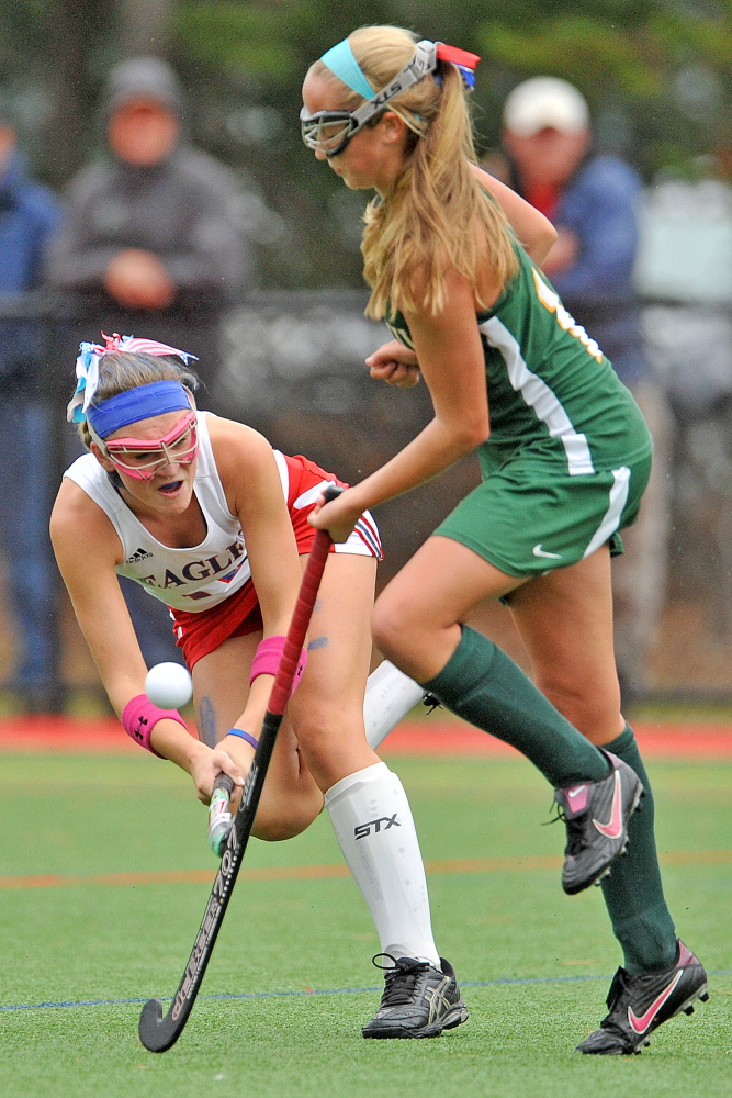 Messalonskee’s Riley Field, left, battles for the ball with Oxford Hills’ Allysa Turner in the first half of an Eastern A quarterfinals game at Thomas College in Waterville last October.