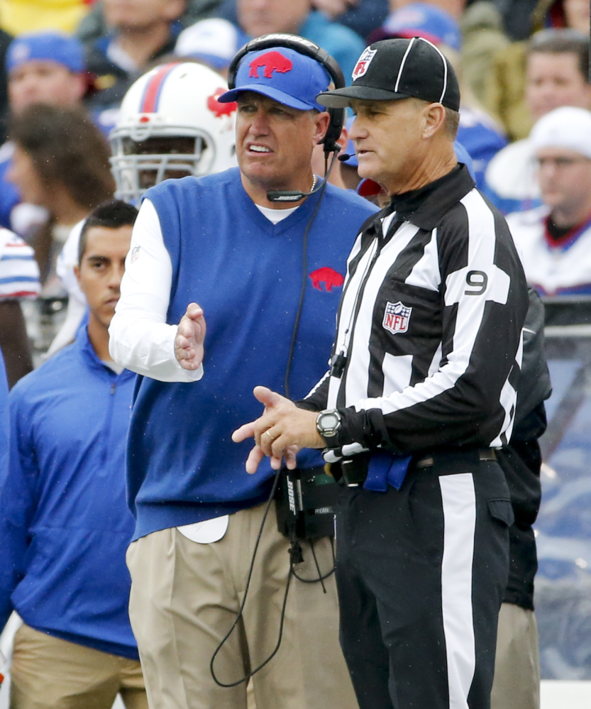 Buffalo Bills head coach Rex Ryan, left, talks with line judge Mark Perlman, right, during the first half of a game against the Indianapolis Colts last Sunday in Orchard Park, N.Y. The Bills play the New England Patriots on Sunday.