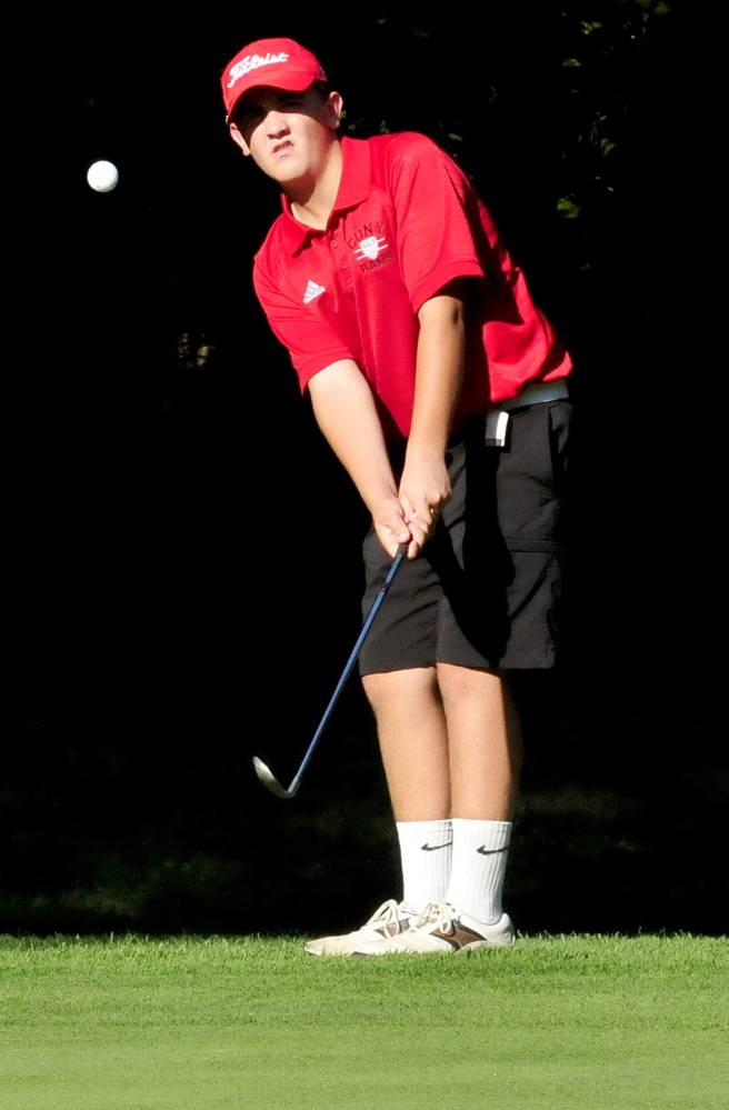 Cony’s Jake Whitley chips a shot during match against Lawrence on Wednesday at Clinton Golf Course. Whitley defeated Michaela Hues 3 and 2. The Rams won the match 9-0.