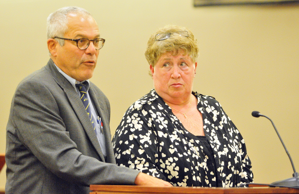 Defense attorney Walter Hanstein stands with Julie A. Smith as she pleads not guilty to embezzlement Thursday in the Somerset County criminal case at the Capital Judicial Center in Augusta.