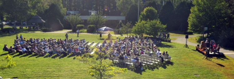 People listen to speeches in the center of campus during the convocation Friday at the University of Maine at Augusta.