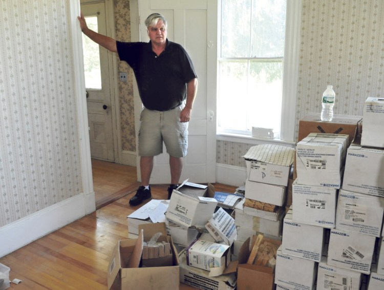 Trinity Evangelical Free Church Pastor Richard Berry speaks on Thursday inside a room of a property near the Skowhegan church that will become office space. Items in the room have been donated by supporters.