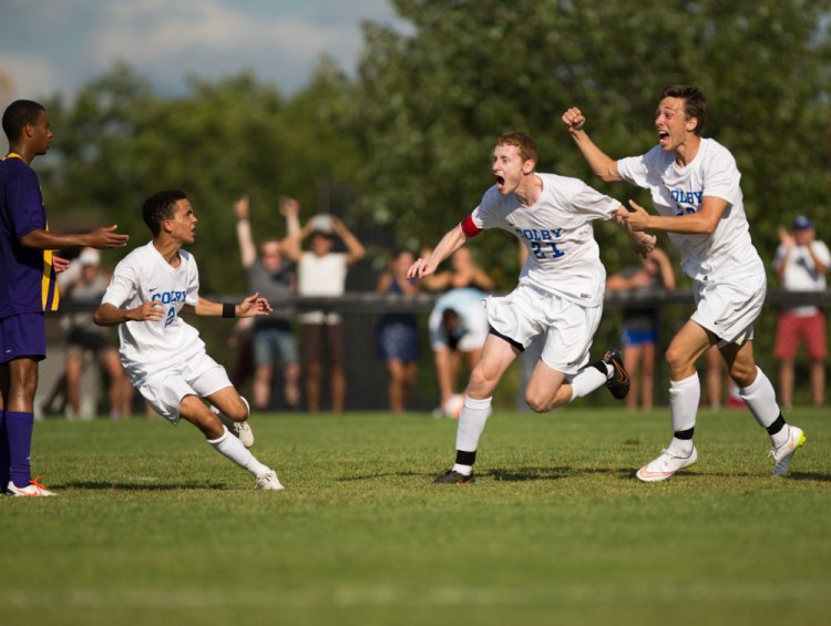 Contributed photo/Colby athletics
Colby’s Tim Stanton, Brandon Fahlberg and Kyle Douglas celebrate after they stunned Williams 2-1 in double overtime on Saturday in Waterville. It was the first victory over the Ephs in 15 years.