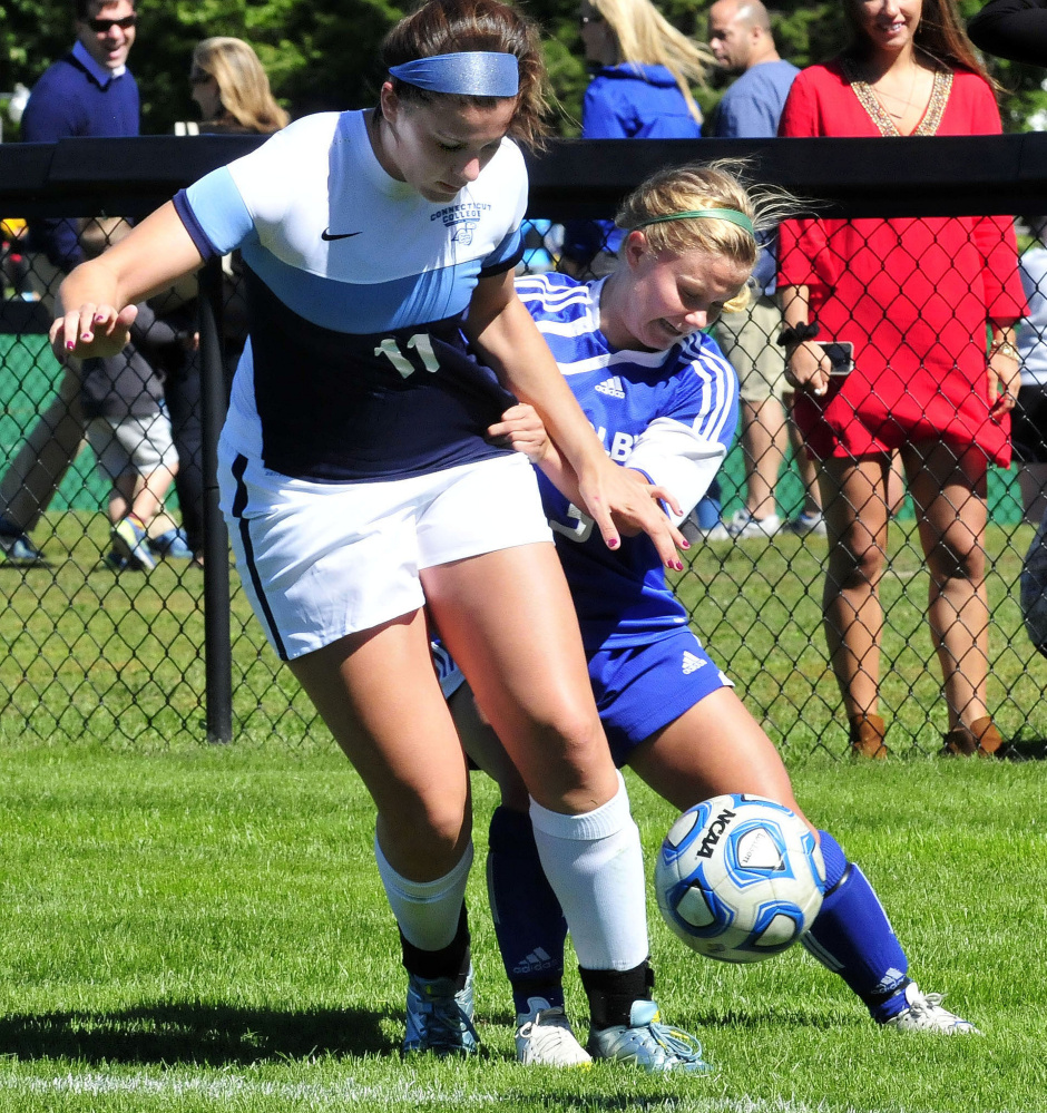 Colby ‘s Laura Arnold, right, and Connecticut College player Alex Bukovac fight for ball possession during a game Sunday.