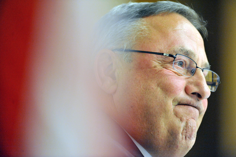 Gov. Paul Lepage smiles Tuesday during a town hall-style meeting at Thomas Auditorium at Preble Hall at the University of Maine at Farmington.