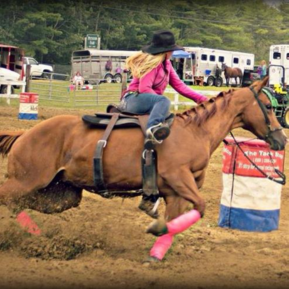 Halee Cummings competes in a barrel race. The teen, who died in an ATV accident Friday, loved horses and competition.