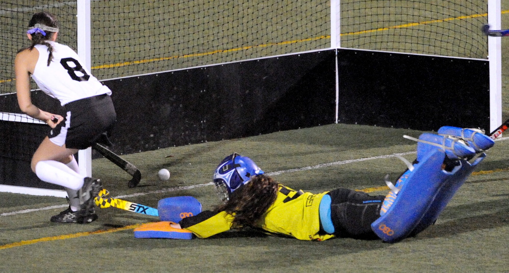 Staff file photo by Michael G. Seamans 
 Skowgean Area High School forward Brooke Michonski, left, scores a goal against Lawrence during the Eastern Class A title game last October at Hampden Academy. Michonski missed the first seven games this season with an injury, but is back with the Indians.