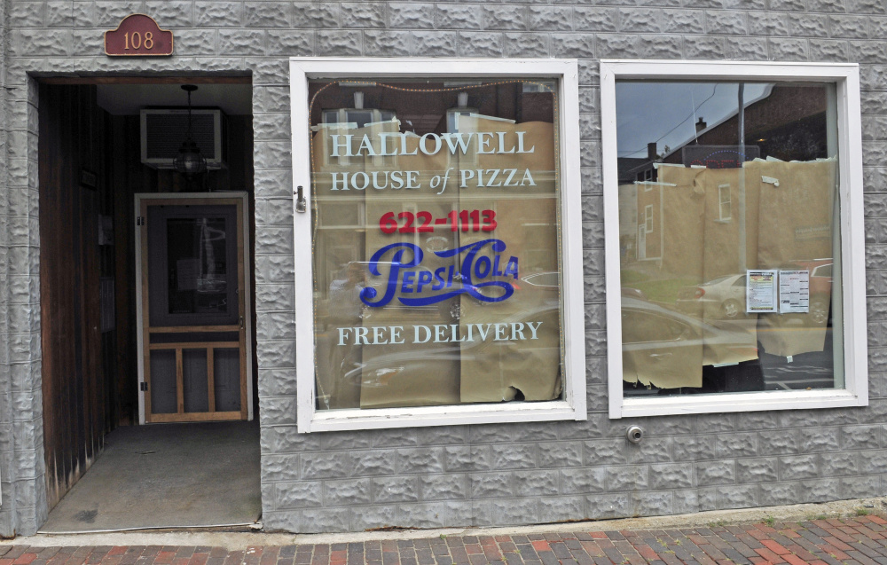 Seating at the Hallowell House of Pizza was damaged and the wall was spray-painted inside the restaurant earlier this month. The restaurant remains closed on Tuesday nearly two weeks after someone broke in and damaged the building before stealing money.