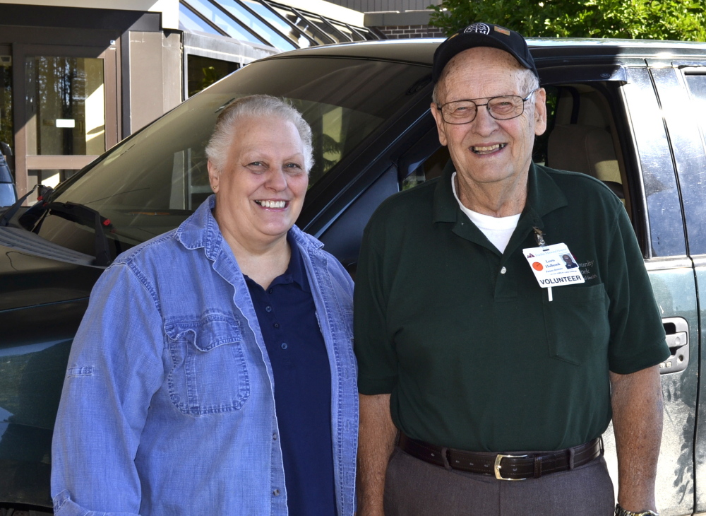 Two current FMH volunteers, from left, are Pam Yenco, of Farmington, manager of the gift shop, and Lewis Holbrook, of New Vineyard, who helps patients needing parking assistance.