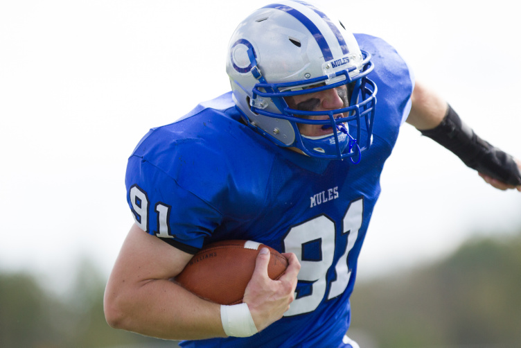 Contributed photo/Colby College 
 Stephen O'Grady returns an interception during a 2013 game. O'Grady returns as one of the leaders on the Mules.