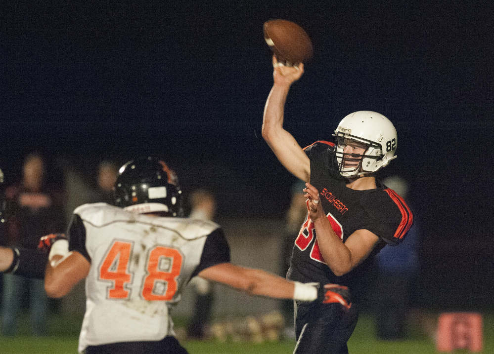 Kevin Bennett photo 
 Skowhegan's Garrett McSweeney throws a pass during a Pine Tree Conference Class B game against Brewer on Friday night in Skowhegan.