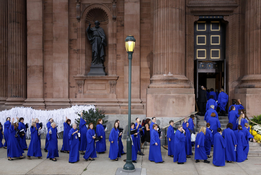Members of a choir file into the Cathedral Basilica of Sts. Peter and Paul in Philadelphia, on Saturday before a Mass with Pope Francis.