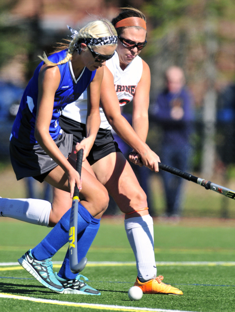 Staff photo by Joe Phelan 
 Lawrence's Hallee Parlin, left, tries to get around Gardiner defender Skye Lavoie during a Class B game Saturday at Thomas College.