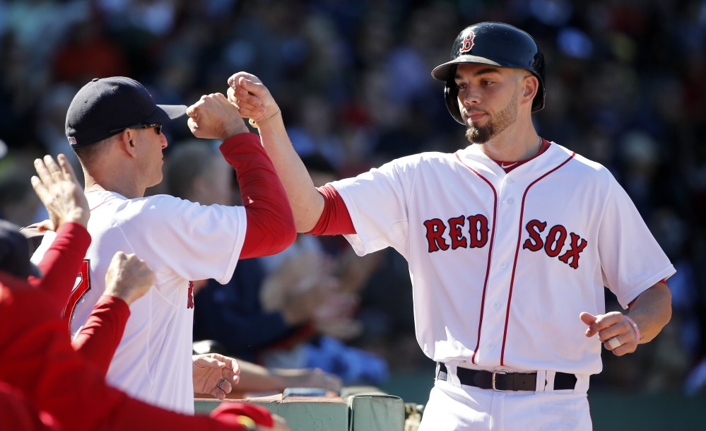 Boston’s Blake Swihart, right, celebrates his solo home run with interim manager Torey Lovullo during the third inning against the Baltimore Orioles on Sunday in Boston.