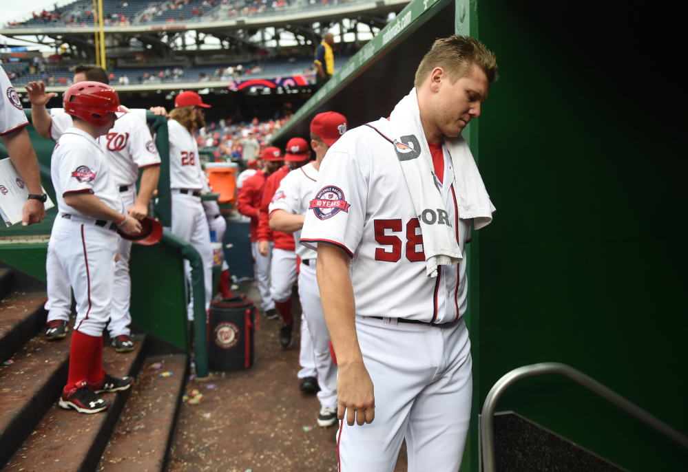 Washington Post photo by Jonathan Newton 
 Washington Nationals relief pitcher Jonathan Papelbon leaves the dugout following their loss to the Phillies on Sunday. The Nats suspended Papelbon four games for his role in a fight with teammate Bryce Harper.