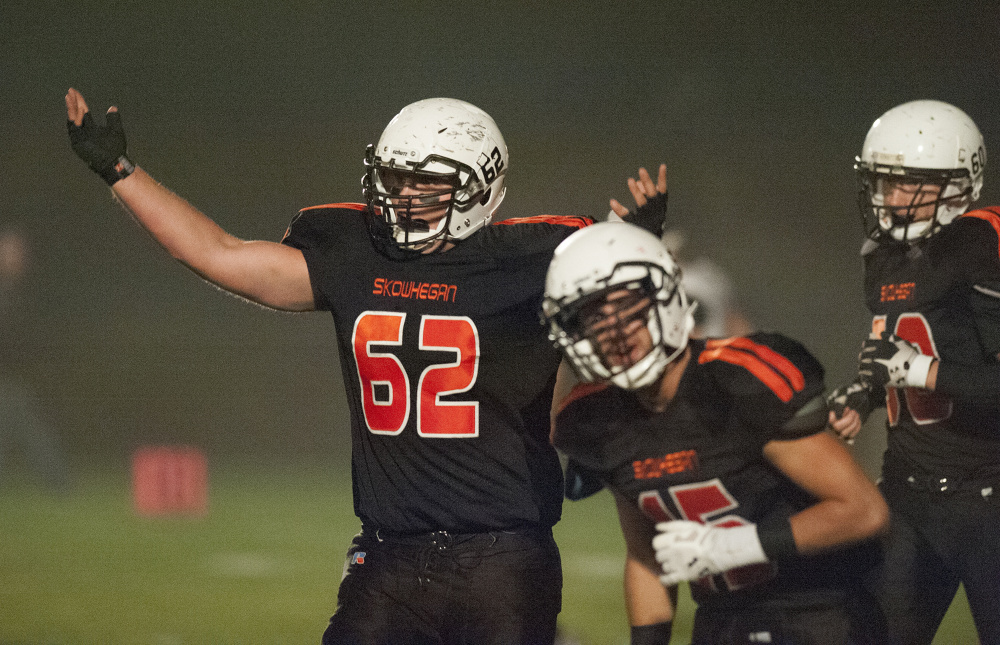 Kevin Bennett photo 
 Skowhegan's Owen Boardman (62) celebrates after Skowhegan's first touchdown of a Pine Tree Conference Class B game against Brewer last Friday night at Skowhegan. The Indians prevailed, setting up a showdown in Brunswick on Friday night.