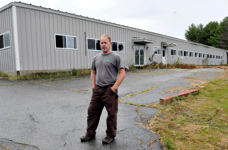 John Black speaks outside the former Wilton Tanning company on Tuesday. He bought the property in May and plans to renovate for his business ventures and lease space to other businesses. The town is holding a ribbon-cutting Thursday.