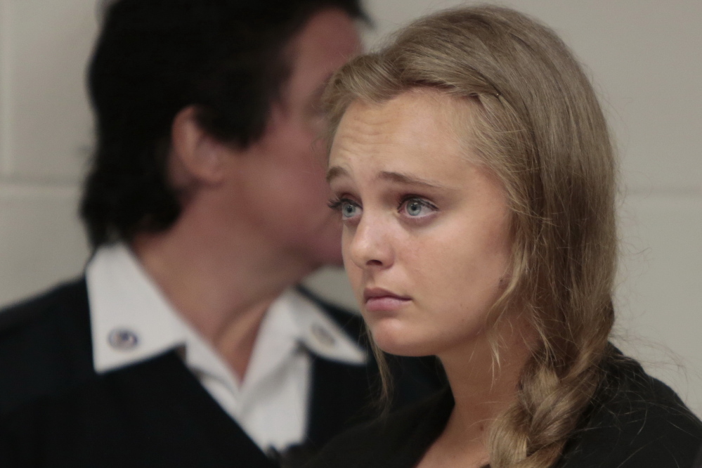Michelle Carter listens to attorney Joseph P. Cataldo argue for dismissing involuntary manslaughter charges against her at Juvenile Court in New Bedford, Mass., last week.