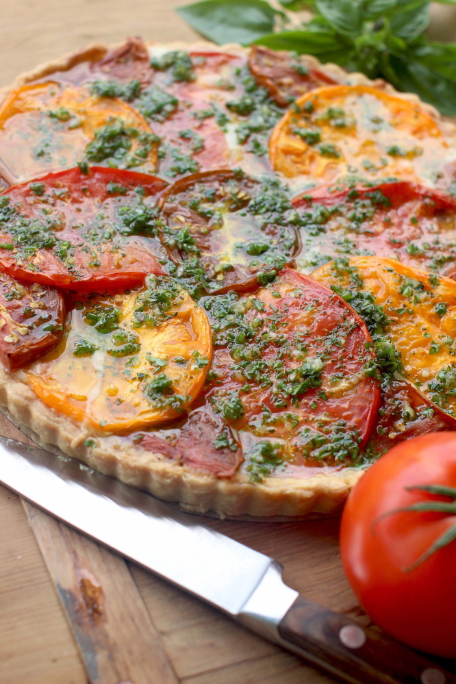 A tomato tart with Gruyere and herbs.