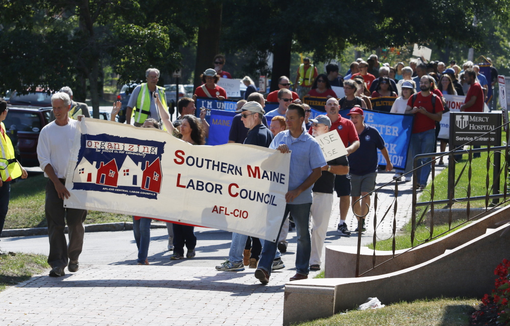 Members of the Southern Maine Labor Council lead a Labor Day march Monday in Portland.