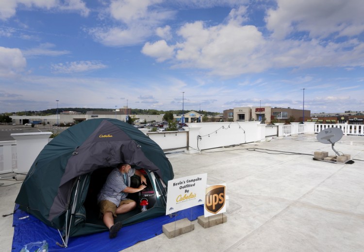 Kevin Fitzpatrick of Scarborough has been camping on the roof of Jimmy the Greek’s at the Maine Mall since Friday as a part of a fundraiser for STRIVE, a program designed to address the many issues of young people with developmental disabilities. He says he will remain on the roof until he reaches his goal of $20,000.