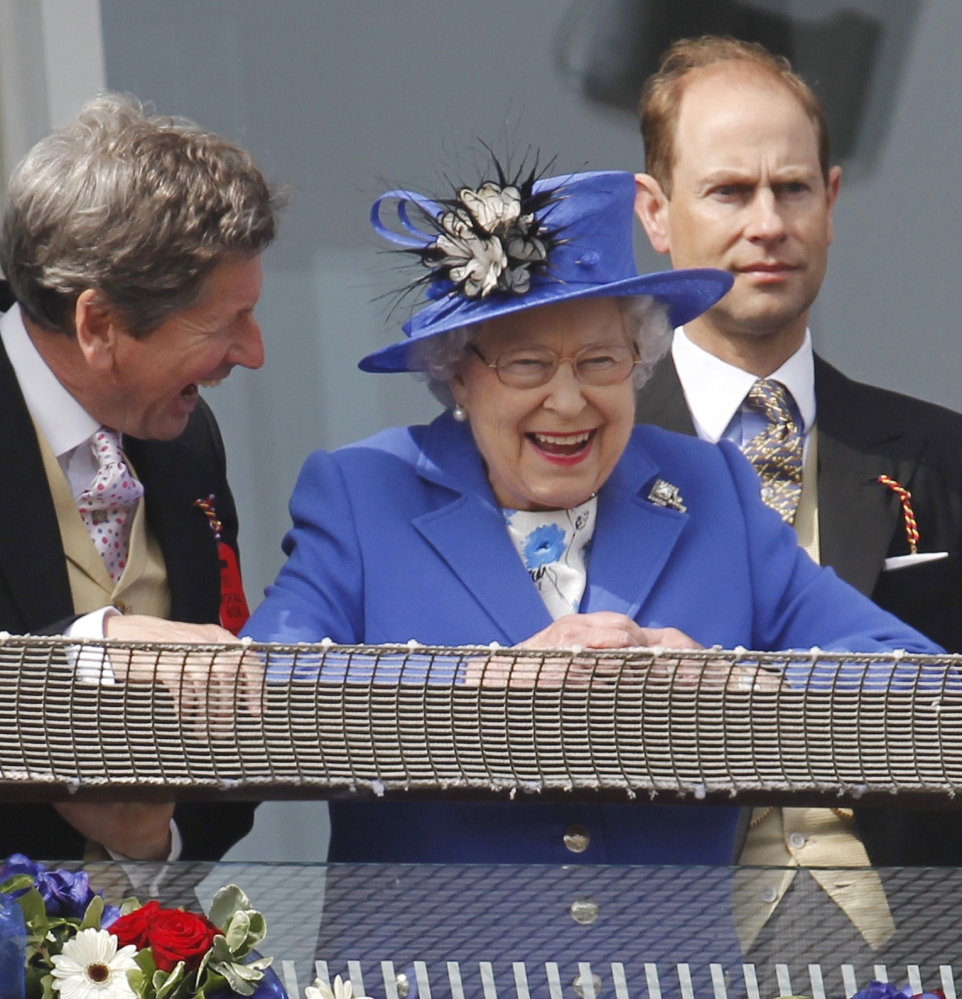 Britain’s Queen Elizabeth II, smiles during a Diamond Jubilee celebration June 2 to mark the 60th anniversary of her accession to the throne. On Wednesday, she breaks Queen Victoria’s record for longevity of reign.