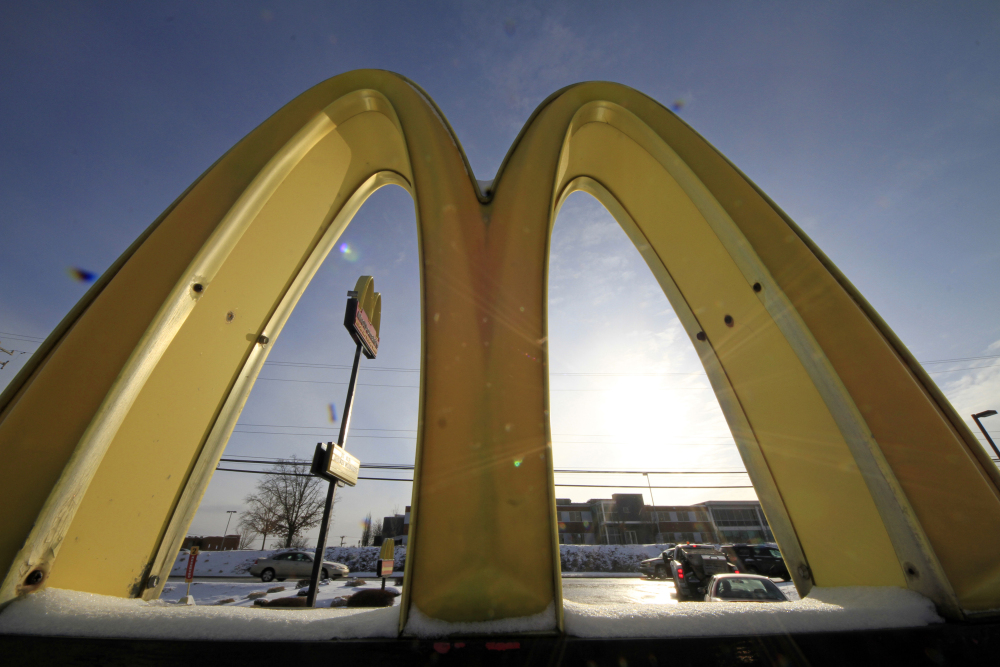 This Jan. 21, 2014 file photo, cars drive past the McDonald’s Golden Arches logo at a McDonald’s restaurant in Robinson Township, Pa.