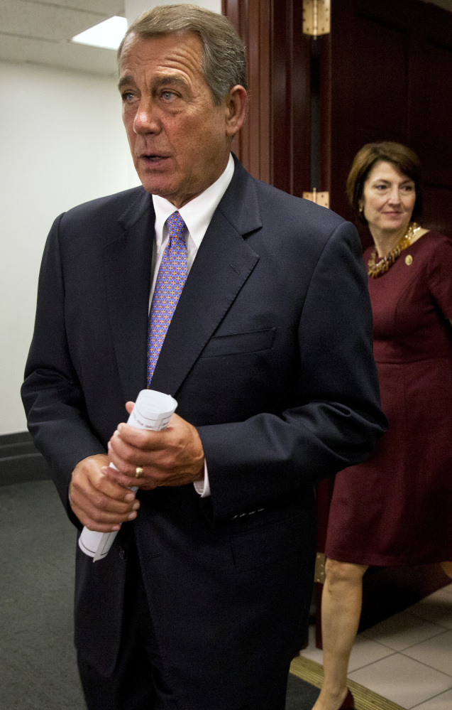 Speaker of the House John Boehner of Ohio walks into a news conference about the Iran deal after meeting with Republicans in Washington.