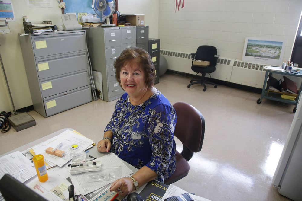 High school nurse Kathleen Gage, instrumental in working for the accepted use of Narcan in Rhode Island schools, sits at her desk at Pilgrim High School.