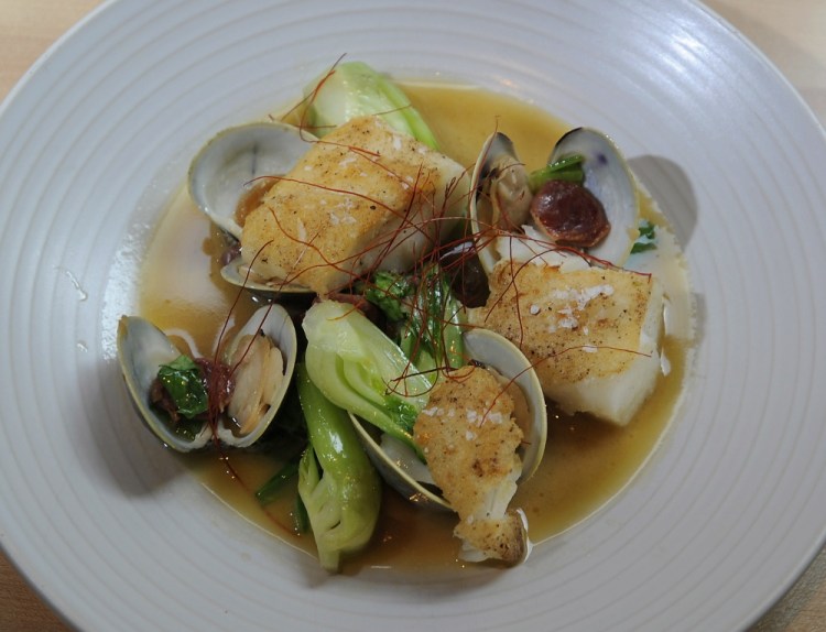 The Roasted Casco Bay Cod dish includes littleneck clams, soy brown butter, bok choy and Chinese fermented sausage.