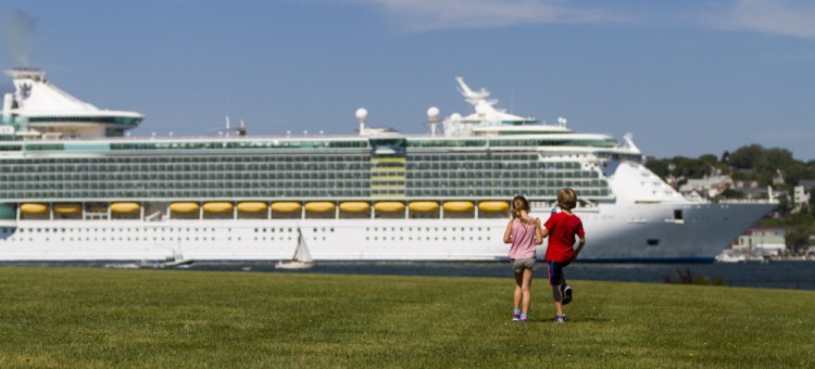 Audrey LeBleu of South Portland and Harry Converse of Cape Elizabeth take a look at the cruise ship Liberty of the Seas from Bug Light Park in South Portland on Saturday.