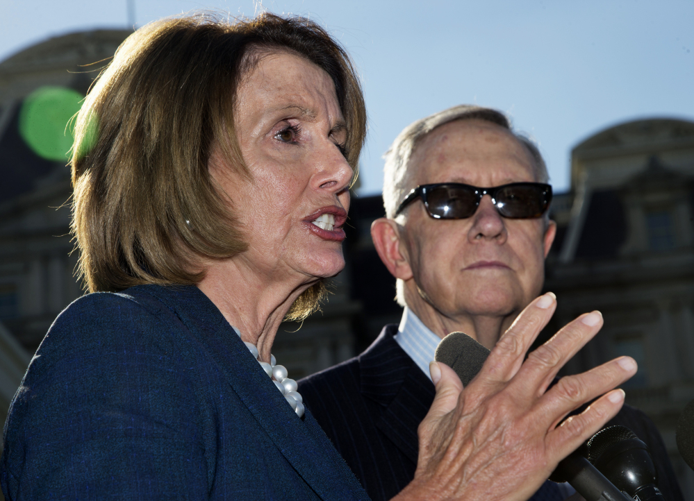 House Minority Leader Nancy Pelosi and Senate Minority Leader Harry Reid leave a meeting with the president over short-term government funding.