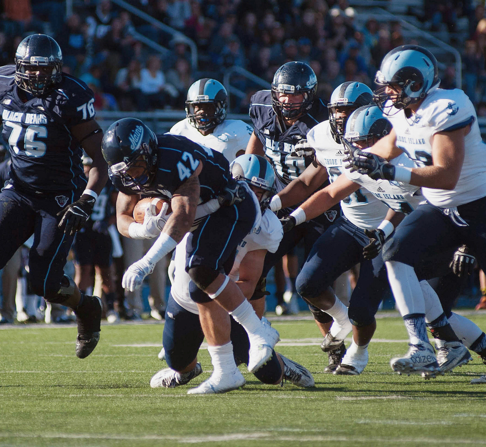 Maine running back Darian Davis-Ray battles for a few more yards against Rhode Island on Saturday. He rushed for 74 yards on 12 carries before leaving with an injury.