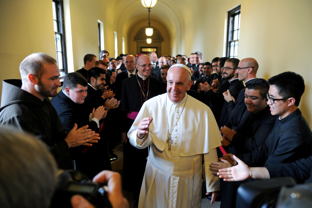 Pope Francis greets seminarians as he walks the loggia to his address to the Bishops at St. Martin of Tours Chapel at St.Charles Borromeo Seminary on Sunday in Wynnewood, Pennsylvania.