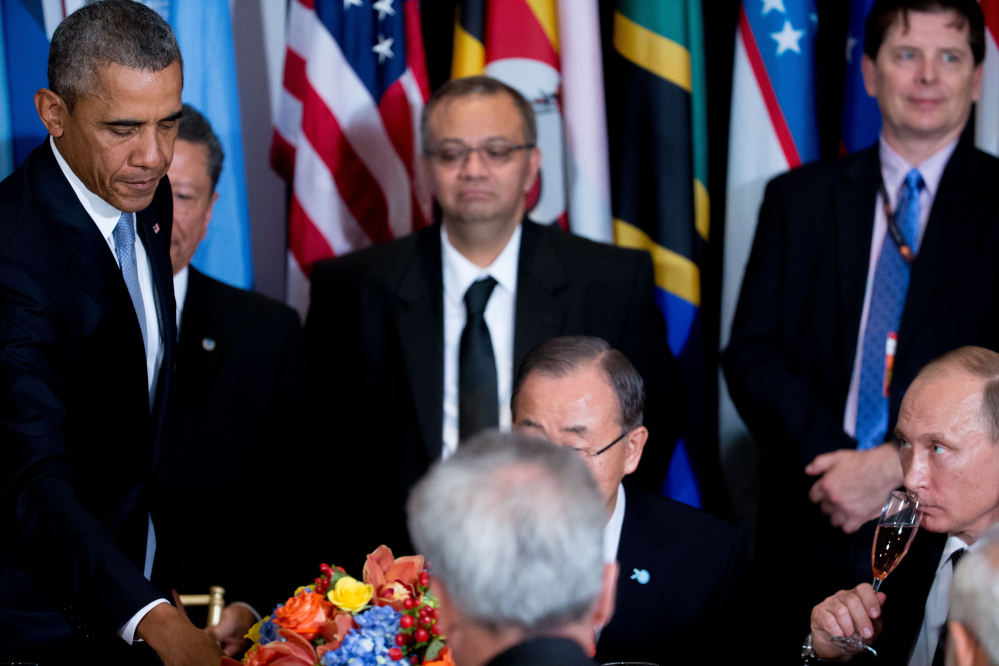 President Obama and Russian President President Vladimir Putin, bottom right, attend a luncheon hosted by United Nations Secretary-General Ban Ki-moon, center, on Monday at United Nations headquarters.