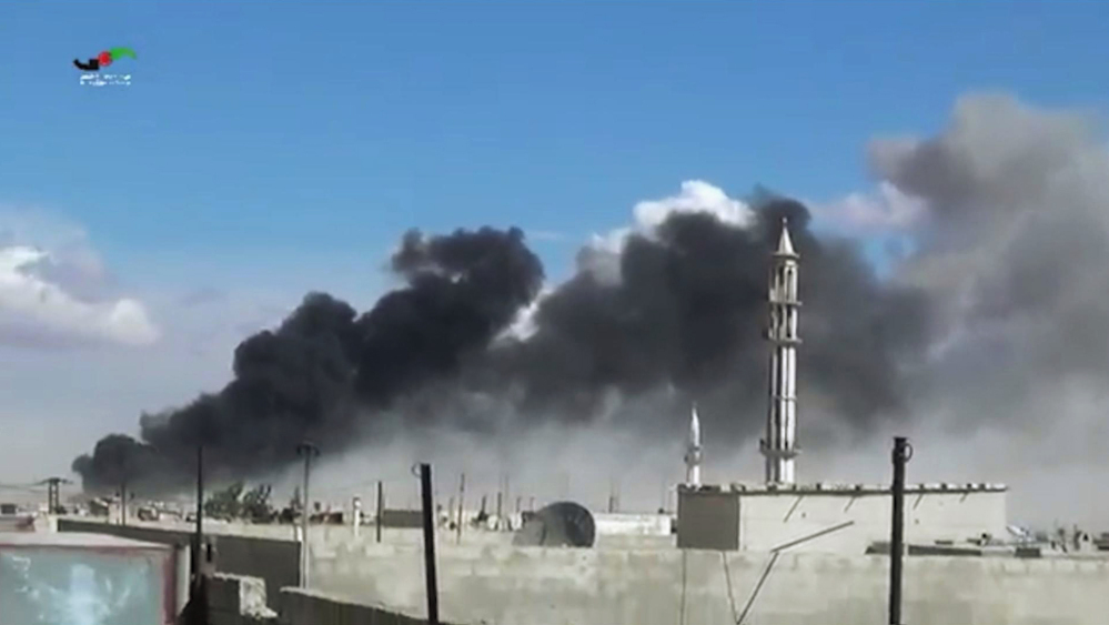 Smoke rises after airstrikes by military jets in Talbiseh of the Homs province in western Syria on Wednesday. Russian military jets carried out airstrikes in Syria for the first time on Wednesday.