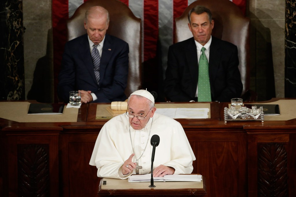 Pope Francis addresses a joint meeting of Congress on Capitol Hill in Washington on Thursday, making history as the first pontiff to do so. Behind the pope are Vice President Joe Biden and House Speaker John Boehner of Ohio. 