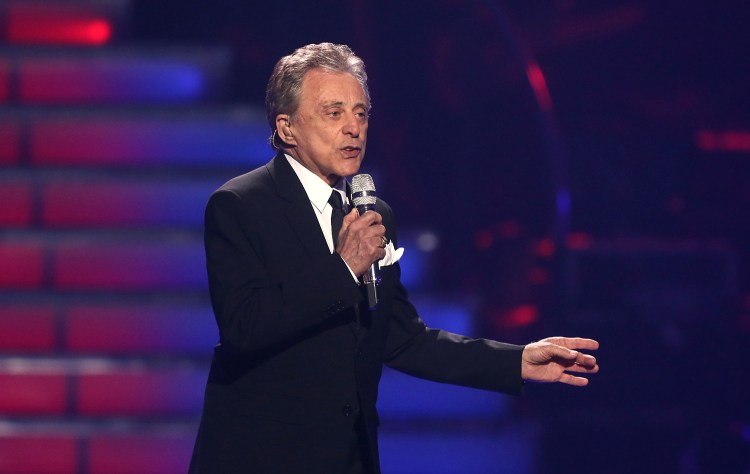 In this May 16, 2013 file photo, Frankie Valli performs at the "American Idol" finale at the Nokia Theatre at L.A. Live in Los Angeles. The man behind the trademark falsetto  “Sherry,” “Big Girls Don’t Cry” and other Four Seasons hits from 50 years ago will be in Portland Saturday along with bandmate Bob Gaudio to honor late Mainer Bob Crewe.