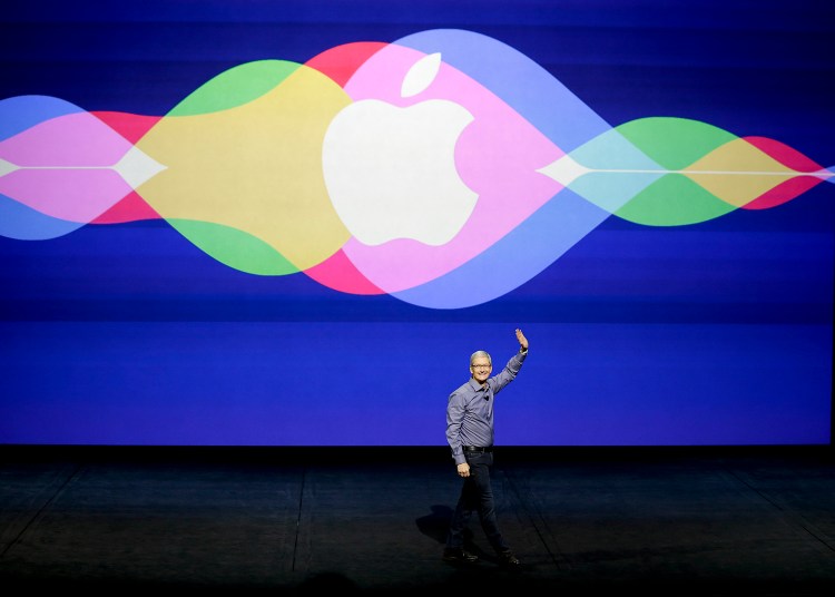 Apple CEO Tim Cook opens the Apple event at the Bill Graham Civic Auditorium in San Francisco, Wednesday. The Associated Press