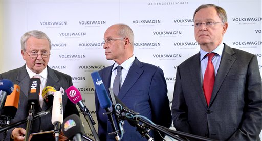Volkswagen supervisory board member Wolfgang Porsche, left, acting board head Berthold Huber, and Stephan Weil, governor of Lower Saxony and member of the board, announce that CEO Martin Winterkorn stepped down. The Associated Press