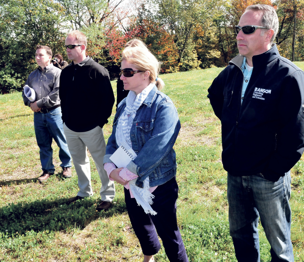 Watching speakers during a ribbon cutting ceremony at the site of the former Wilton Tannery are from left, Steve Govoni of Wentworth Partners, owner John Black, Amy Jean McKeown of the EPA and Nick Sabatine of Ransom Consultants on Thursday.