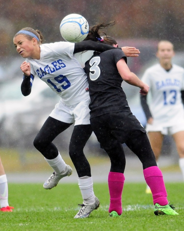 Staff file photo by Joe Phelan 
 Erskine midfielder Avery Bond, left, makes contact with Lincoln midfielder Olivia York during a game in South China last October.